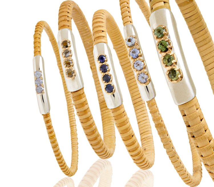 Line of various colored Sapphire Nantucket Basket Bangles, handwoven from natural cane and rattan.