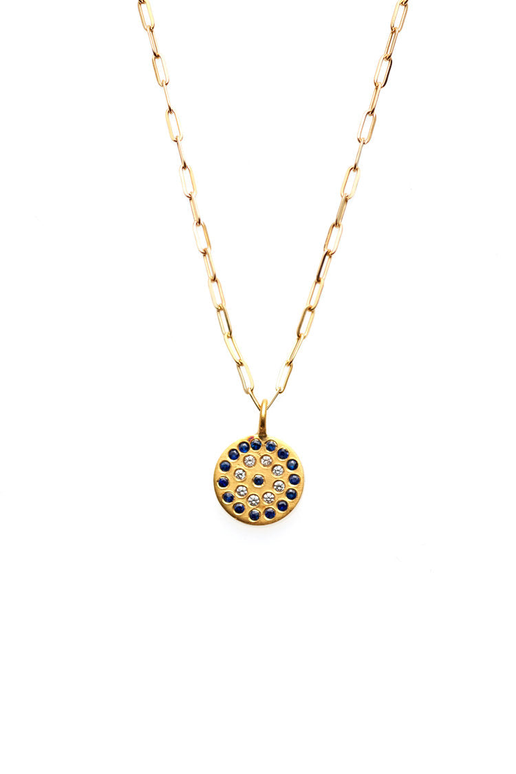 round evil eye style this piece will quickly become a favorite. Sparkling diamonds and deep blue sapphires are so luxurious with 22K yellow gold. 