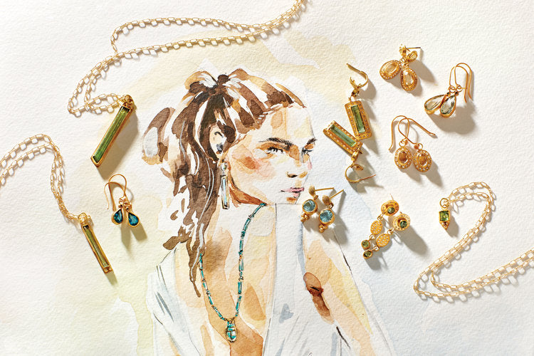 assorted blue and green gold pendants and earrings atop a sketch of a woman in a white dress