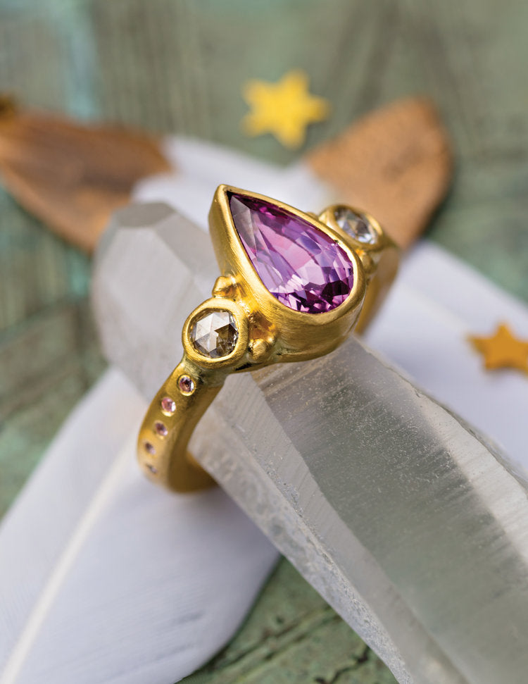 Gold & Pink Sapphire Ring on shaping tool