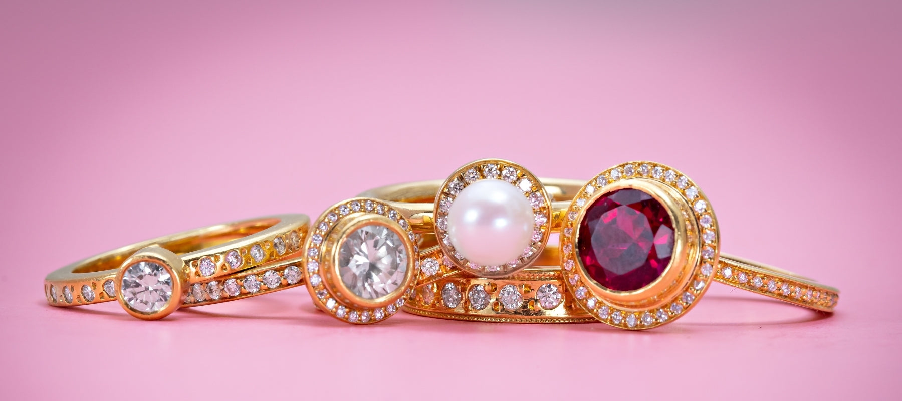 Gold Rings on a pink background