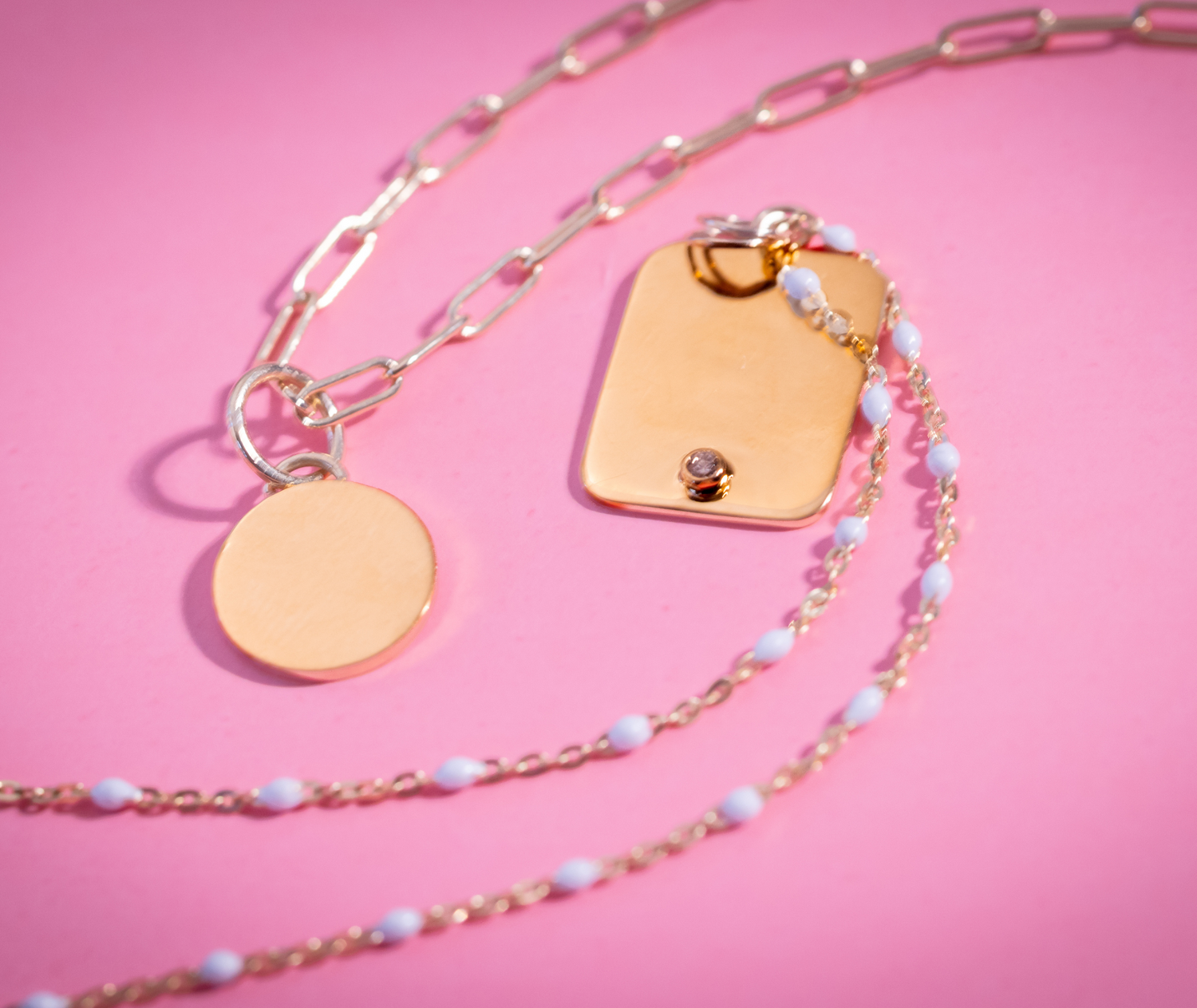 Customizable Pendants on Pink Background