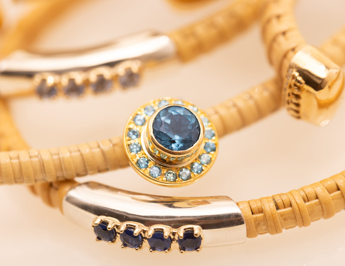 cluster of Nantucket cuffs encrusted with blue stones