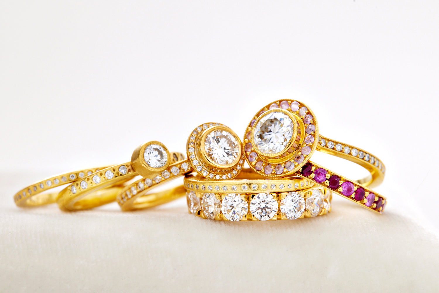 Stack of gold and gemstone rings