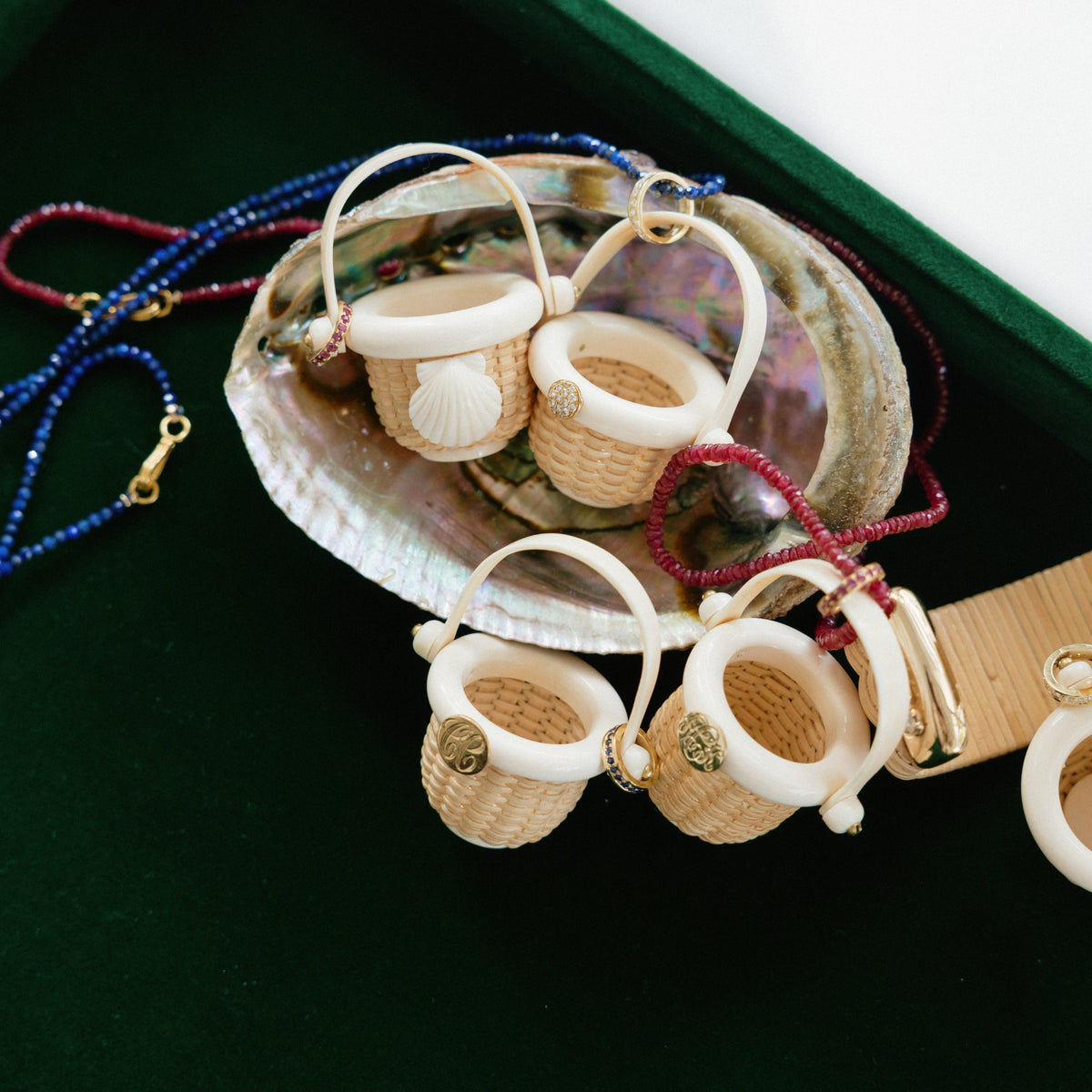 Baby baskets and chains on a velvet green background