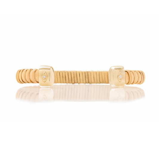 natural rattan woven cuff with gold caps and single diamond