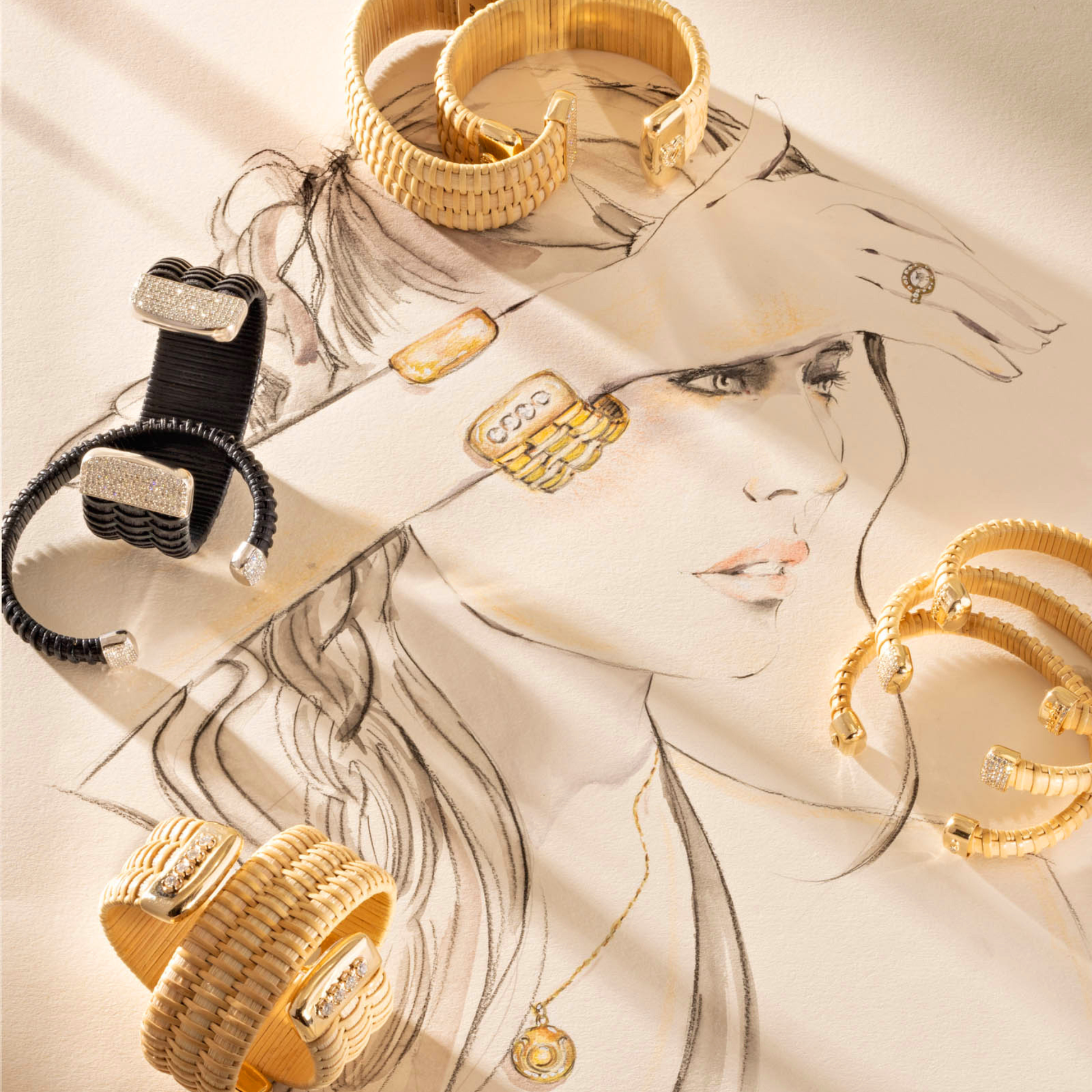woven cuff bracelets wide and narrow in black and natural rattan with gold and silver caps and diamond accents over sketch of woman wearing jewelry