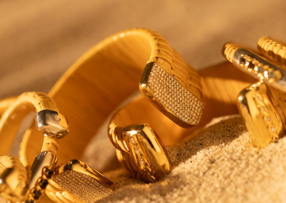 Bay Sail Nantucket Lightship Basket 1" Cuff, handwoven from natural cane and rattan, with Gold and Diamonds in sand with other cuffs.