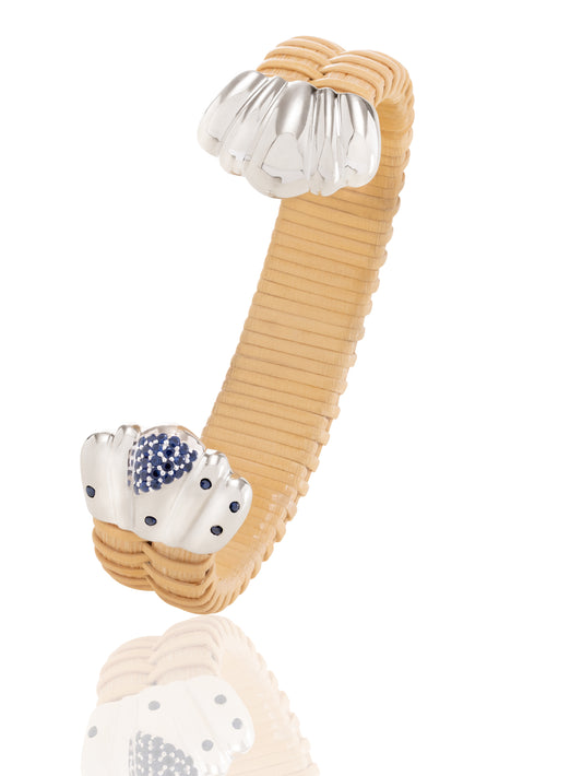 Basket weave bracelet with silver scalloped caps and blue sapphires