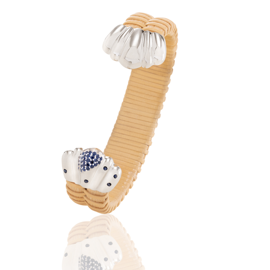 natural rattan woven cuff bracelet with silver scalloped cap and blue sapphires