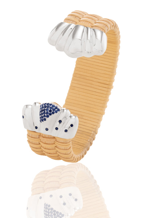 Basket weave bracelet with silver scalloped caps and blue sapphires