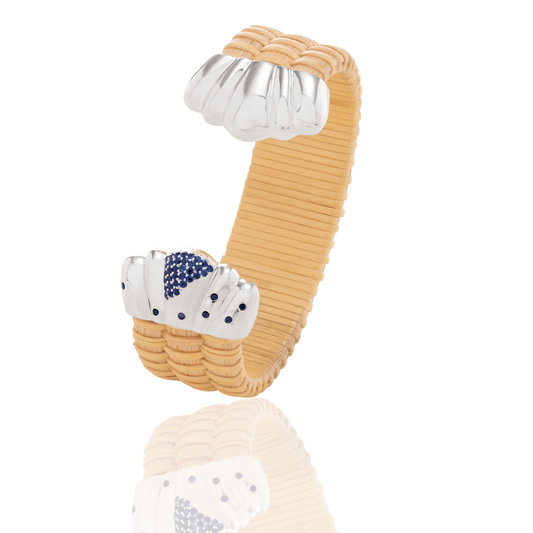Basket weave bracelet with silver scalloped caps and blue sapphires