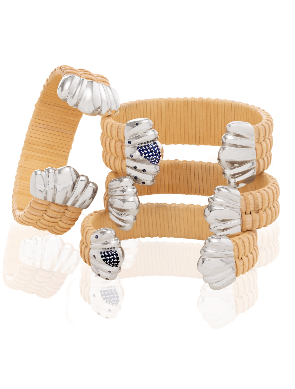 stack of four Basket weave bracelets with silver scalloped caps and blue sapphires