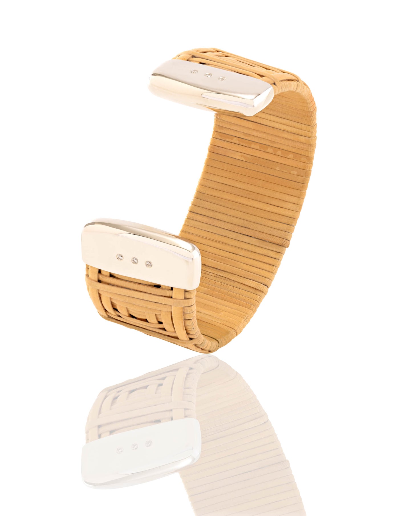 Nantucket Basket Lightship cuff, handwoven from natural cane and rattan, with sterling silver caps and six brilliant-cut diamonds.