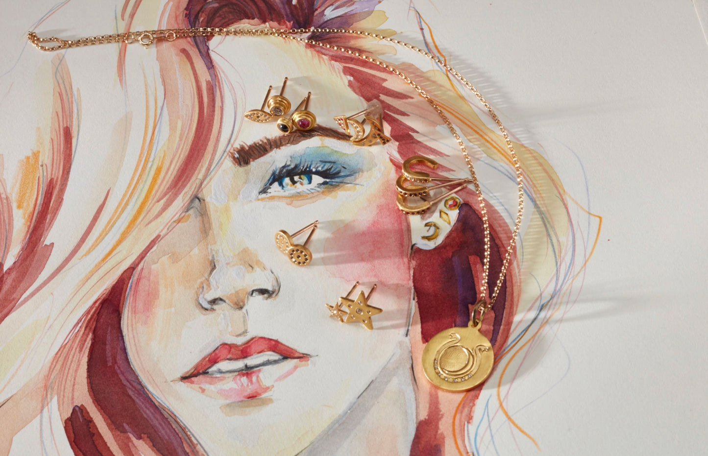 studs on drawing of a woman with red hair]