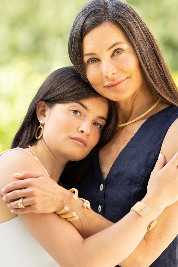 Paris & Lily Founder and jewelry designer Jen and daughter embracing wearing Paris & Lily jewelry