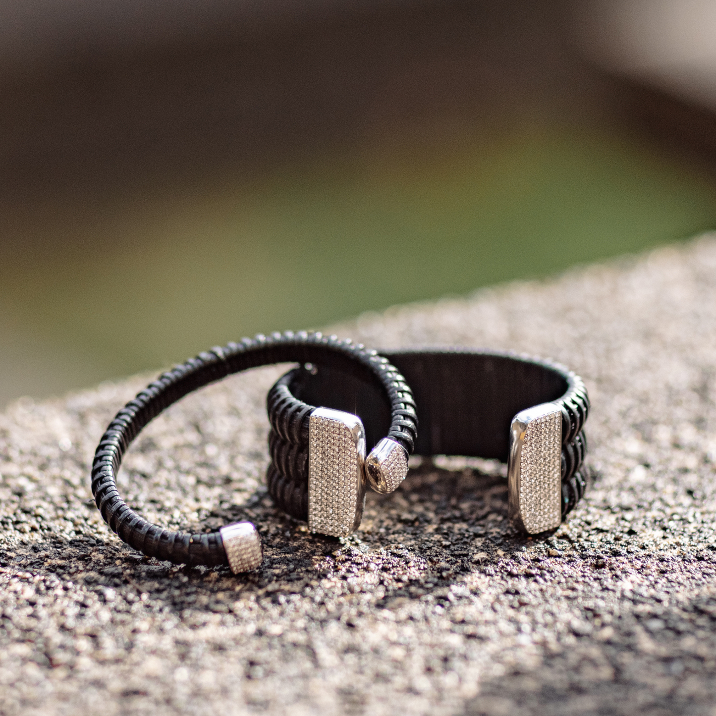 Midnight Swim Nantucket Lightship Basket 1" Cuff with White Gold and Diamonds stacked on stone outside with 1/4" bracelet