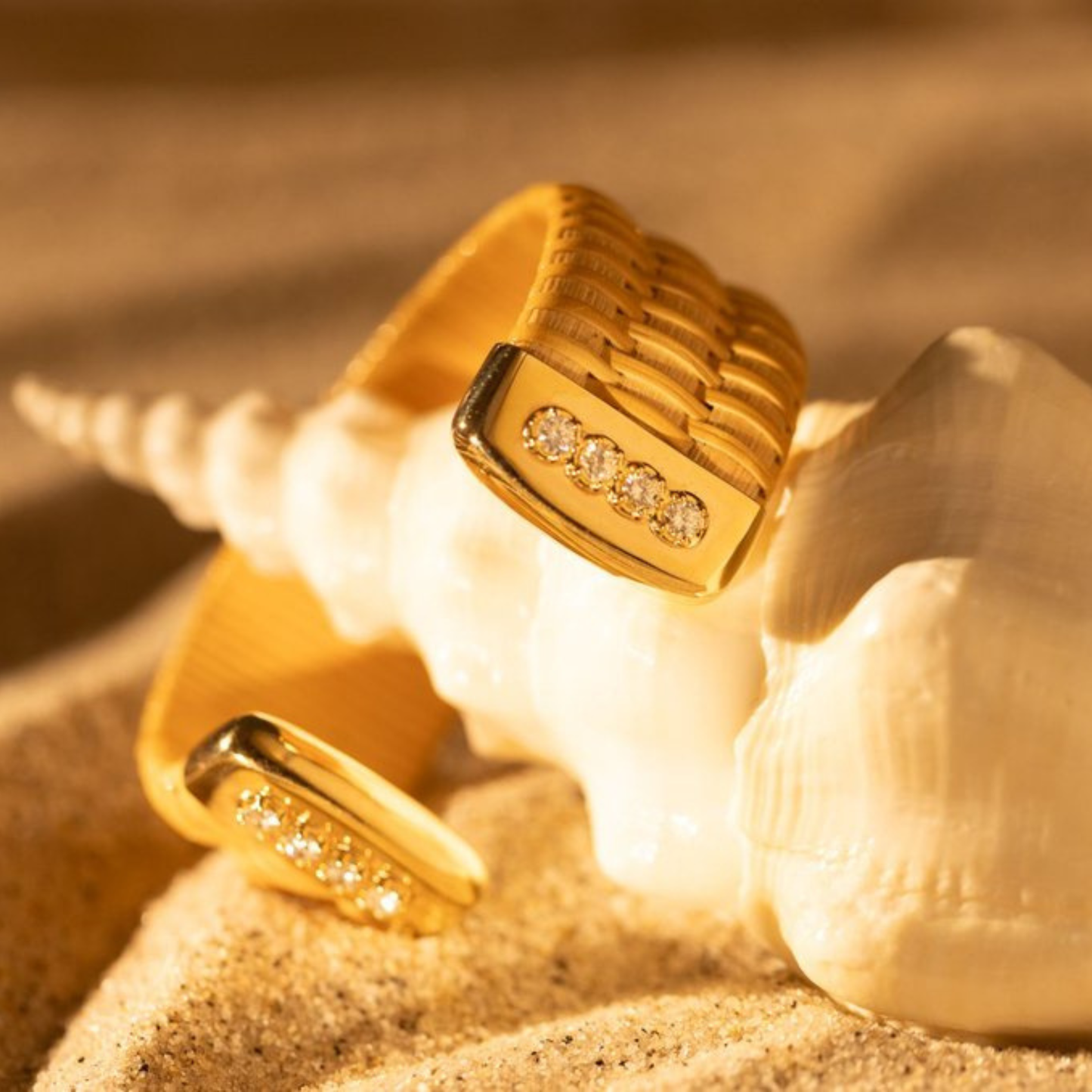large conch shell with woven basket cuff bracelet with gold caps and diamond accents