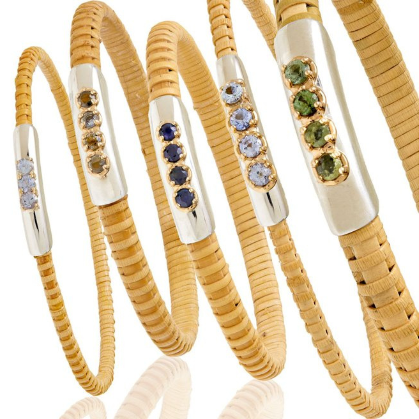 standing batch of Natural rattan woven cuff bracelet with silver band and various gemstones