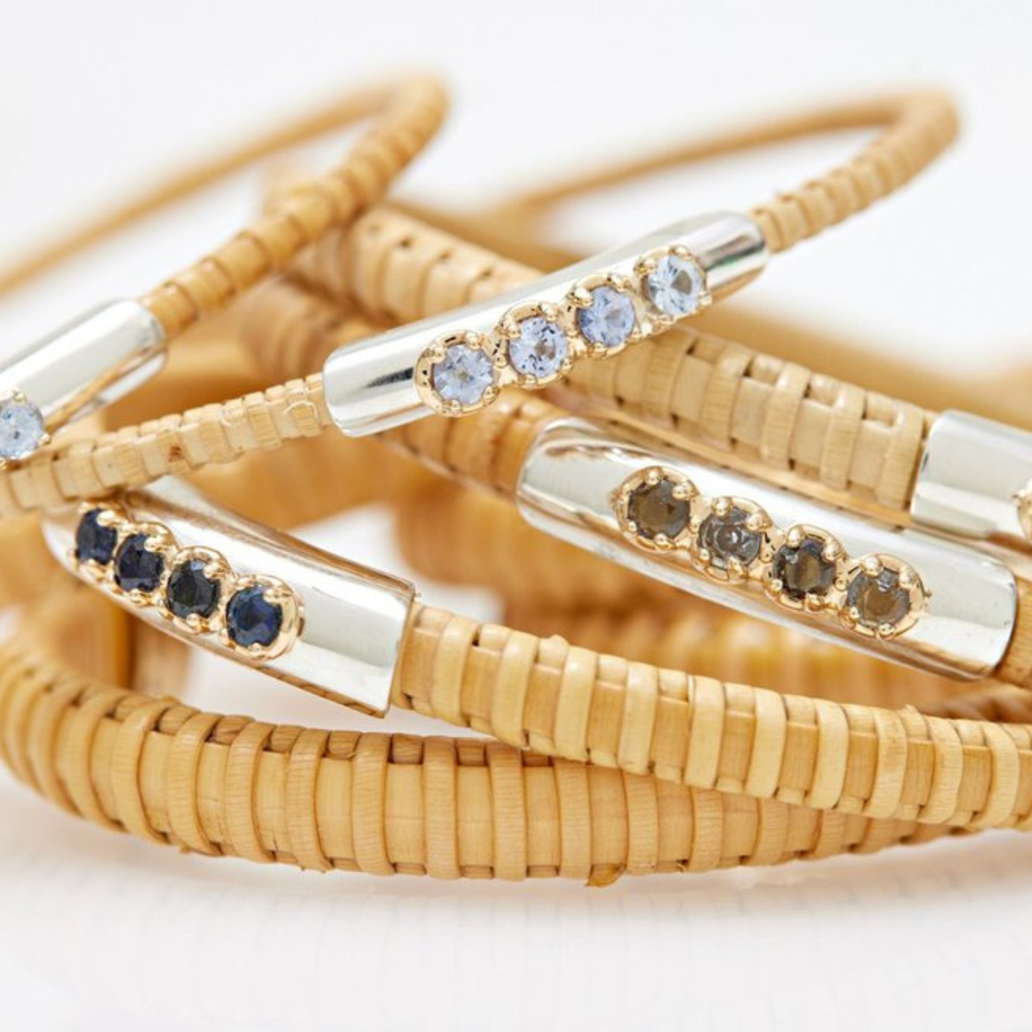 Set of natural rattan woven bracelets with metal accents and colored stones