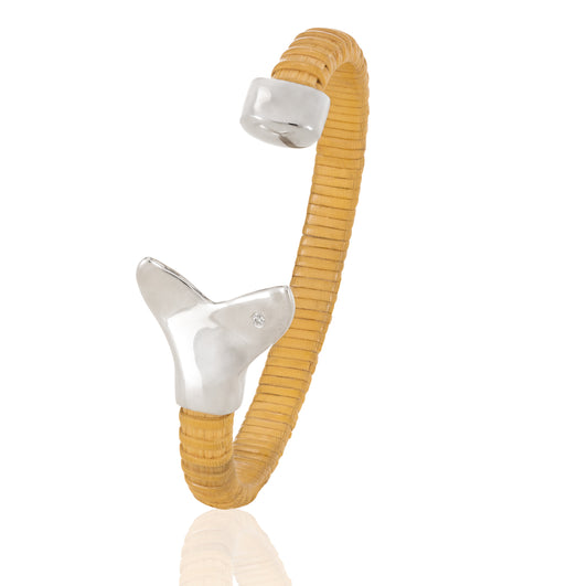 Nantucket Basket Cuff Bracelet with silver whale tail caps and diamond accents on plain background