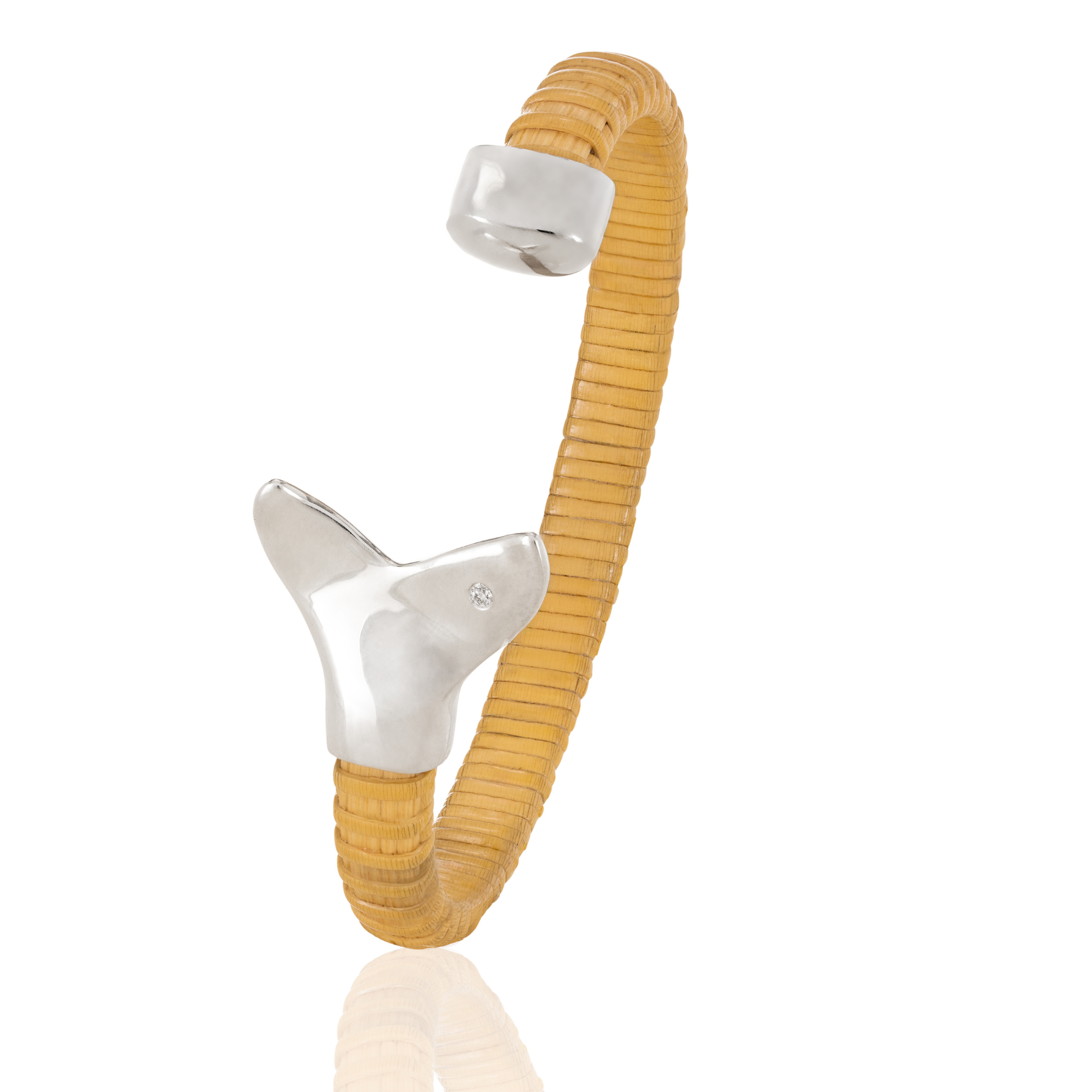 Nantucket Basket Cuff Bracelet with silver whale tail caps and diamond accents on plain background