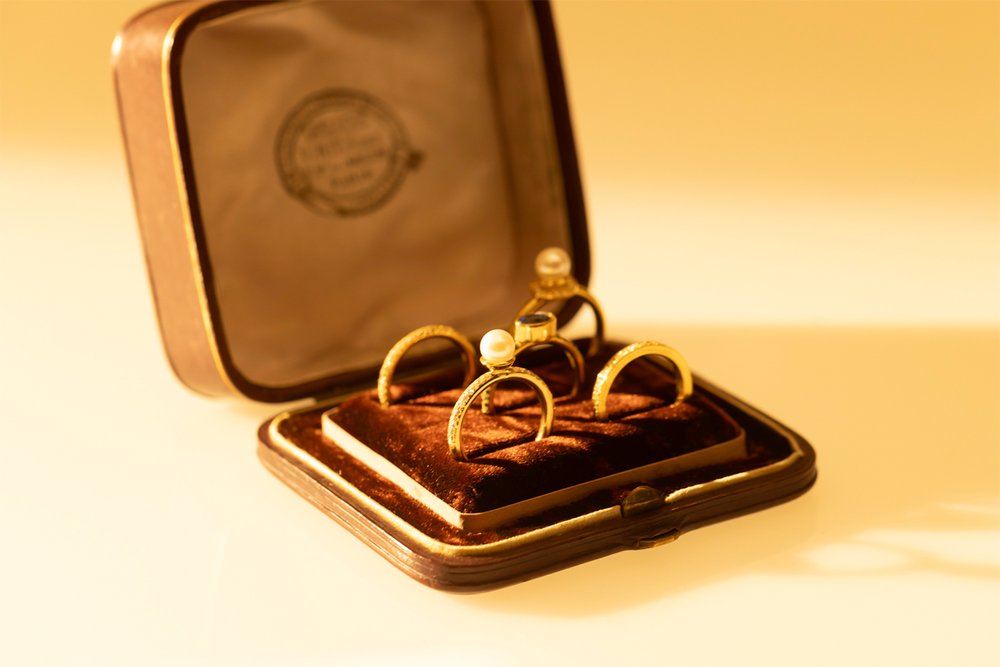 Pave diamond pearl ring in velvet lined box with other rings