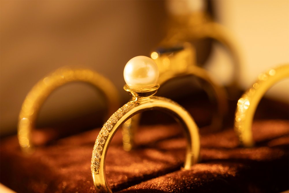 Pave diamond pearl ring in a velvet box