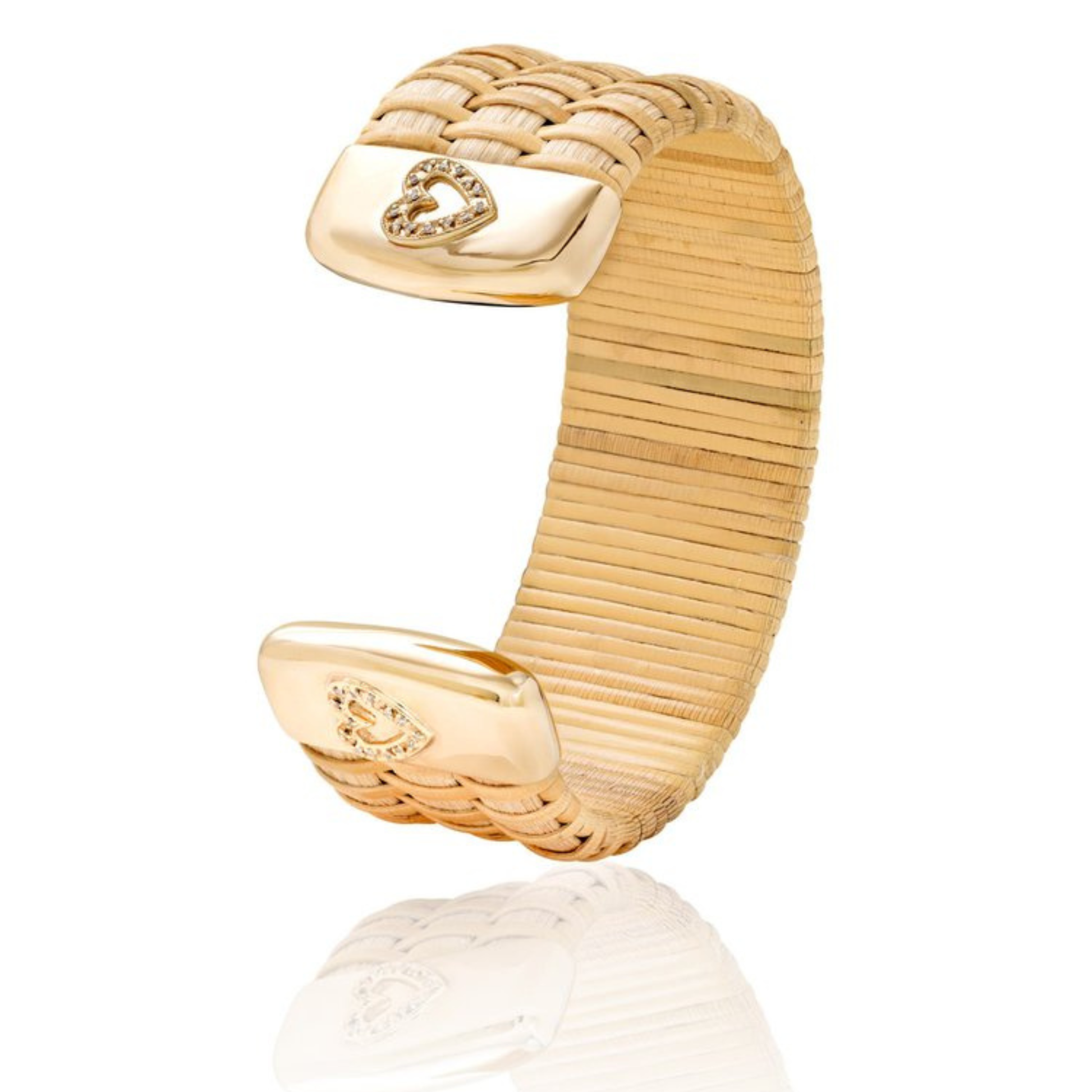 woven cuff bracelet standing on side with gold caps and diamond heart accents