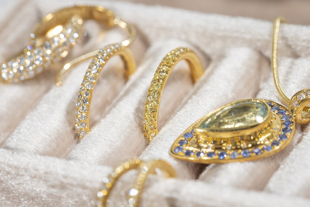 Yellow Diamond Pave Band in box with other luxury jewelry