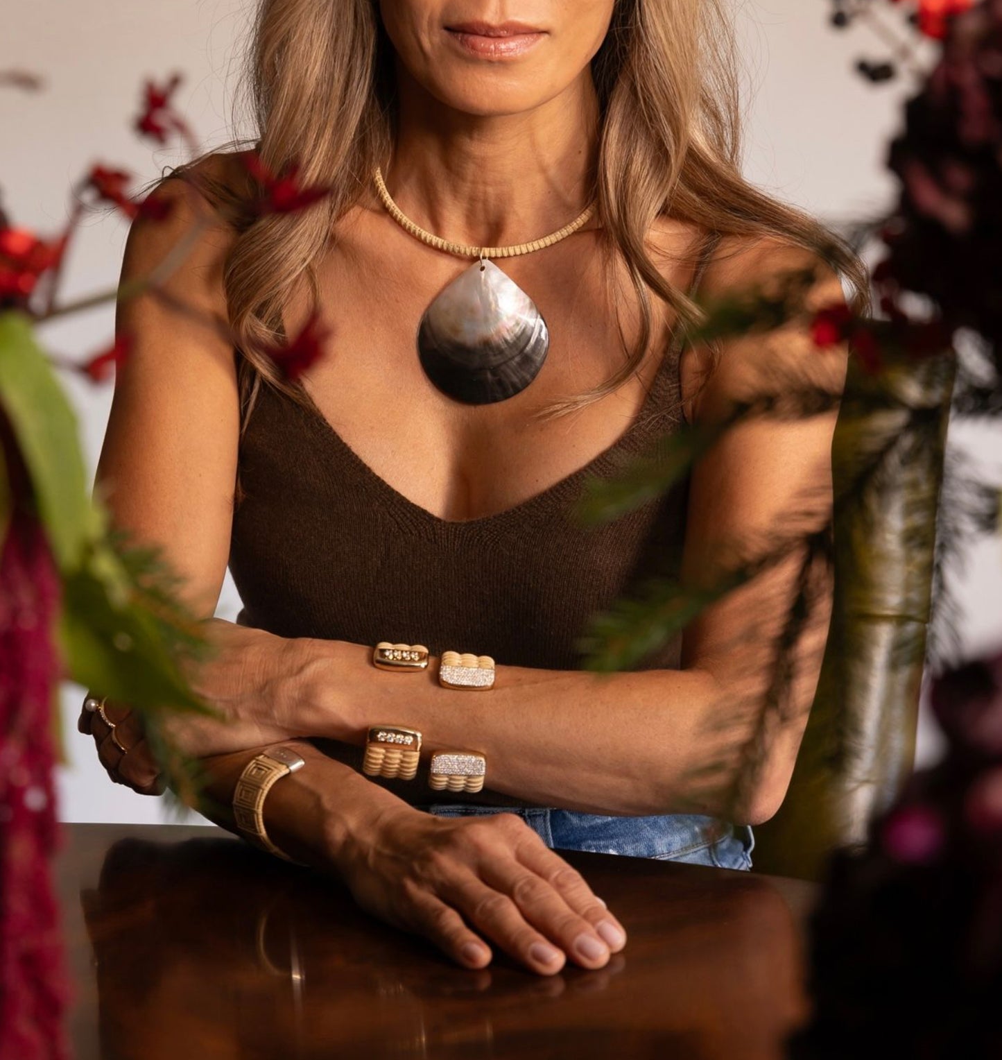 Large shell woven choker necklace on model 