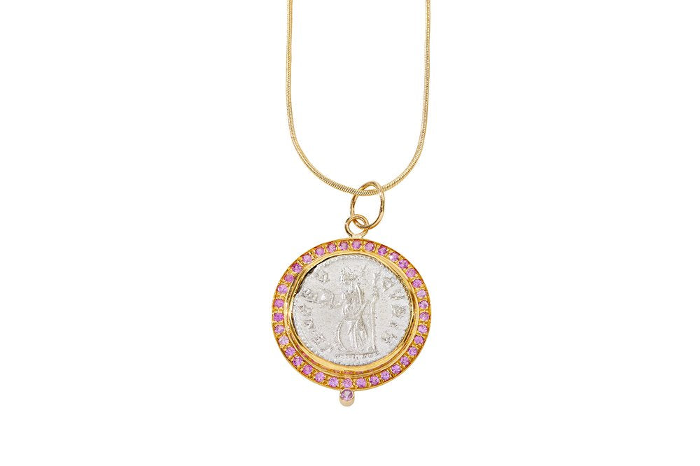  22K gold pendant with an antique silver Roman coin depicting the goddess Venus adorned with pink sapphires