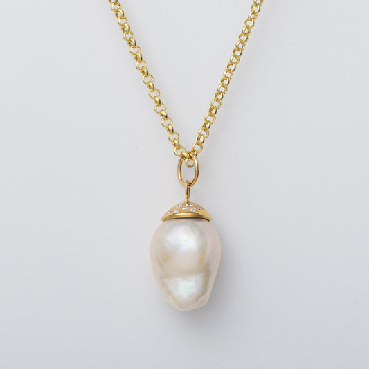 Sun Bath Baroque Pearl & Diamond Pendant NecklaceExquisite &amp; elegant handmade baroque pearl &amp; diamond pendant necklace. A beautiful statement piece alone or layered.